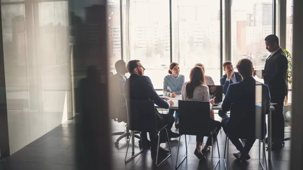 Business meeting in an office at a table.